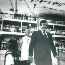 Dr and Mrs William B Walsh walking down gangway on arrival in Maceio.